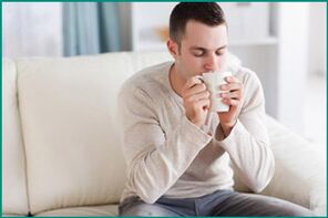 A man drinks mint tea to cure erectile dysfunction. 
